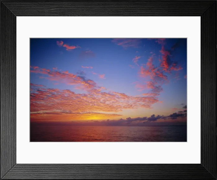 Framed Print : Pink and orange clouds at sunrise over the English Channel, England, UK Framed Print : Pink and orange clouds at sunrise over the English Channel, England, UK
