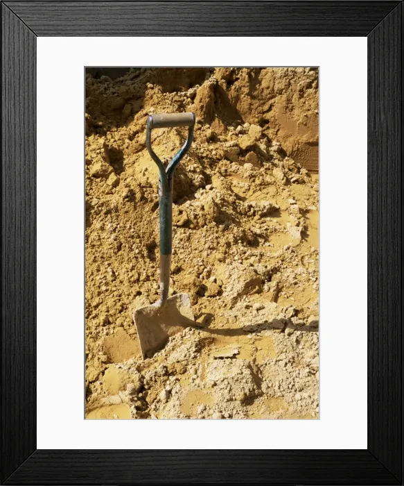 Framed Print : Close-up of spade in sand on a building site, City of London, England, United Kingdom Framed Print : Close-up of spade in sand on a building site, City of London, England, United Kingdom