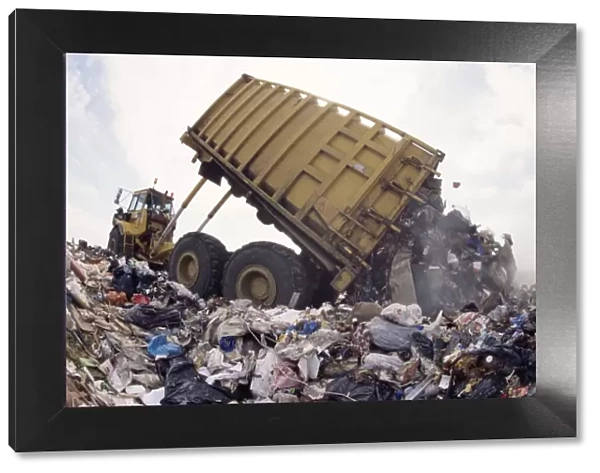 Lorry arrives at waste tipping area at landfill site, Mucking, London, England