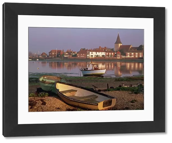 Boats in Bosham from across the tidal creek in early morning, on one of the small inlets of Chichester Harbour, Bosham, West Sussex, England, United