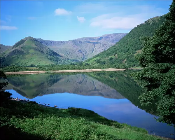 Mountains reflected in still water of the lake, Brothers Water, Lake District