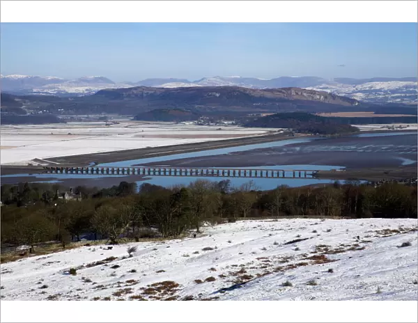 View of Lakeland fells and Kent estuary from Arnside Knott in snow, Cumbria