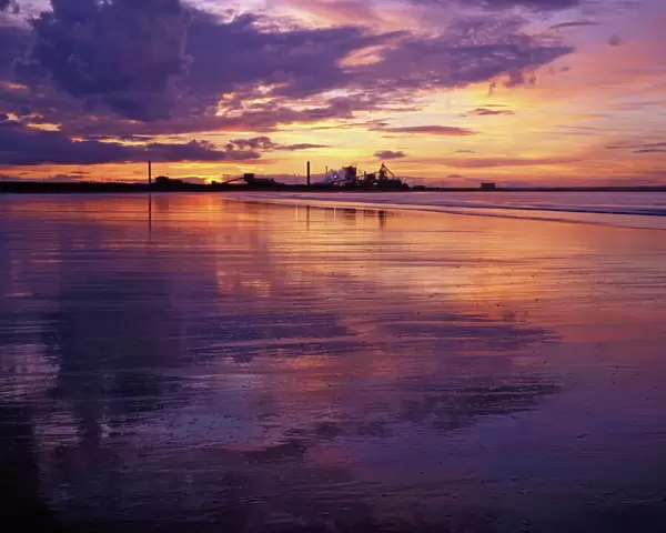 Redcar Beach at sunset with steelworks in the background, Redcar, Cleveland