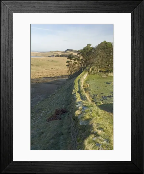 Framed Print : Looking east from wall of Milecastle 37 to Sewingshields Crag and Broomlee Lough Framed Print : Looking east from wall of Milecastle 37 to Sewingshields Crag and Broomlee Lough