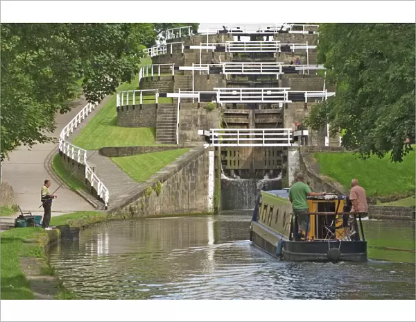 Narrow boat entering the bottom lock of the five lock ladder on the Liverpool Leeds canal