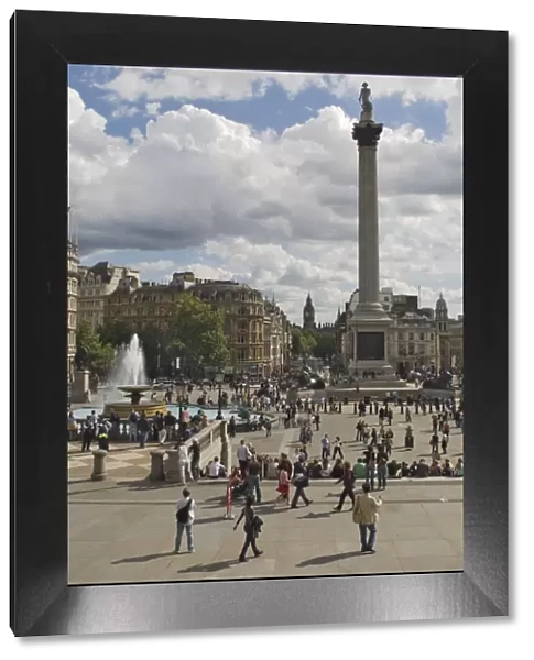 Nelsons Column in Trafalgar Square, with Big Ben in distance, London, England