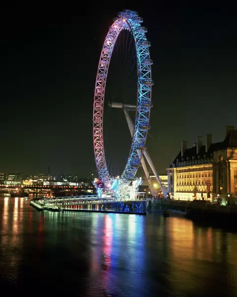 London Eye illuminated by moving coloured lights, London, England, United Kingdom, Europe