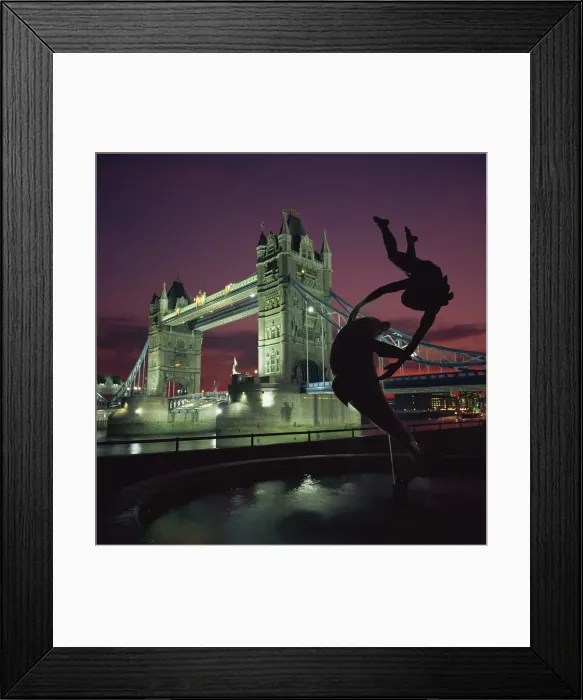 Framed Print : Silhouetted fountain statue and Tower Bridge illuminated at night, London Framed Print : Silhouetted fountain statue and Tower Bridge illuminated at night, London