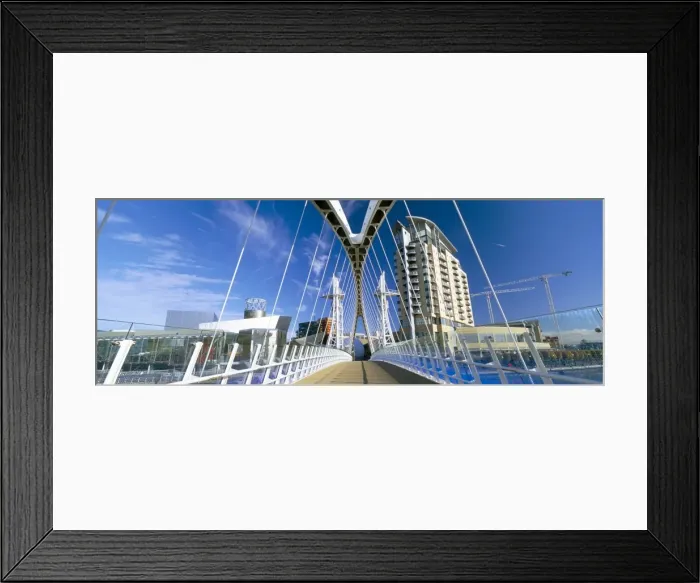 Framed Print : View along pedestrian suspension bridge at Salford Quays, Salford, Manchester Framed Print : View along pedestrian suspension bridge at Salford Quays, Salford, Manchester