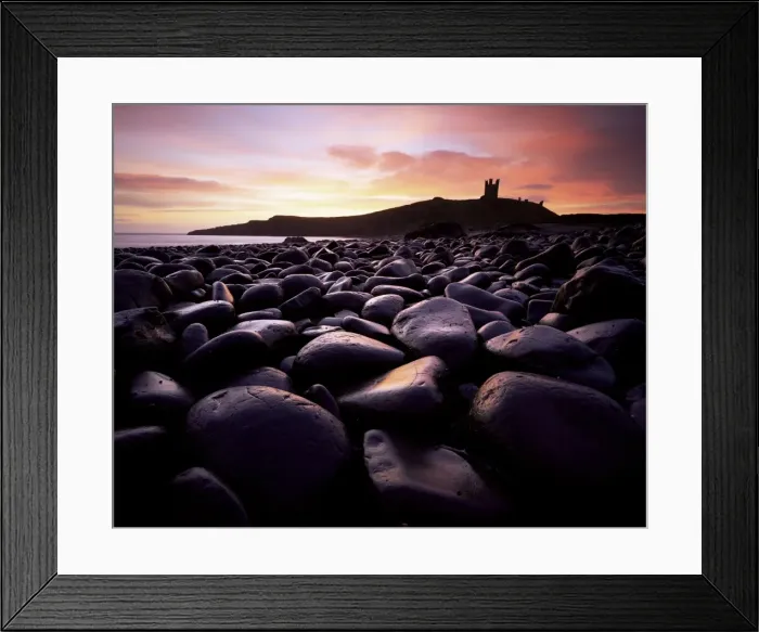 Framed Print : Dunstanburgh Castle at sunrise from Boulderfield at Embleton Bay, Northumberland Framed Print : Dunstanburgh Castle at sunrise from Boulderfield at Embleton Bay, Northumberland