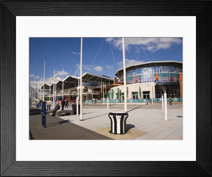 Framed Print : Modern buildings, restaurants and shops at Gunwharf Quays waterfront development in regenerated historic harbour, Portsmouth, Hampshire, England, United Framed Print : Modern buildings, restaurants and shops at Gunwharf Quays waterfront development in regenerated historic harbour, Portsmouth, Hampshire, England, United
