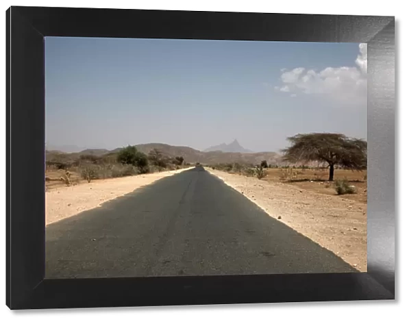 An empty road and the barren landscape of western Eritrea, Africa