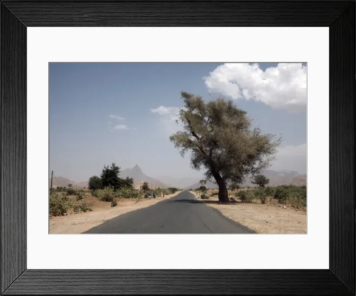 Framed Print : An empty road and the barren landscape of western Eritrea, Africa Framed Print : An empty road and the barren landscape of western Eritrea, Africa