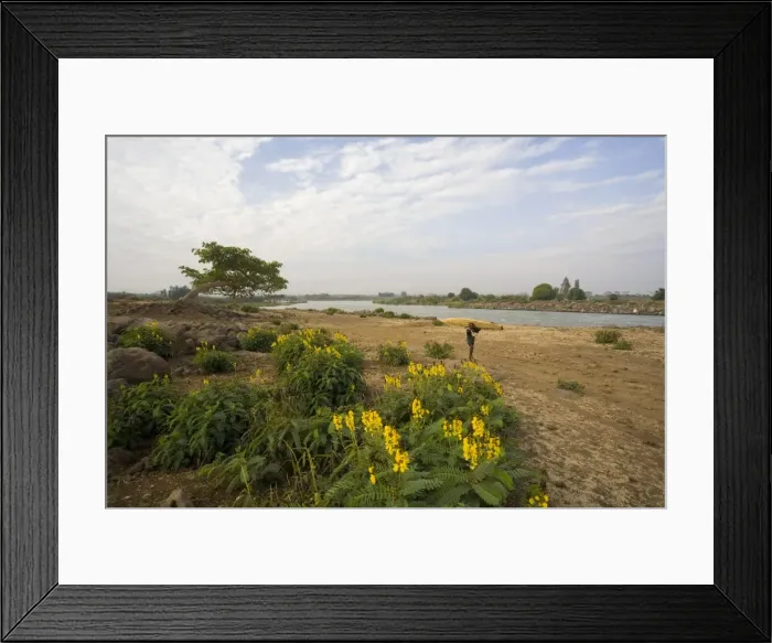 Framed Print : The famous outlet of the Blue Nile into Lake Tana, local man carrying a tankwa Framed Print : The famous outlet of the Blue Nile into Lake Tana, local man carrying a tankwa