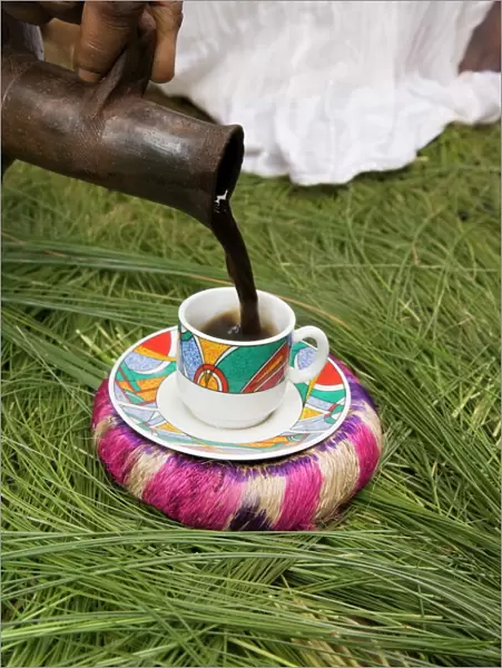 Pouring coffee during a coffee ceremony, Ethiopia, Africa