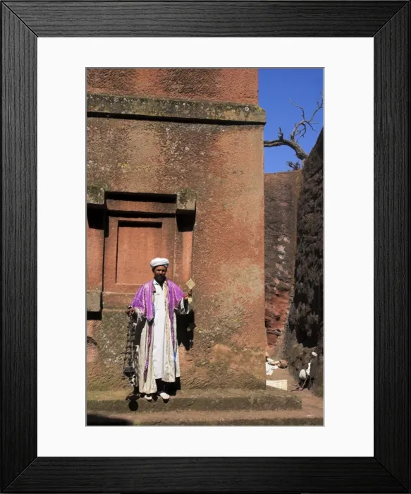 Framed Print : Priest holding cross swings an incense burner at the rock-hewn monolithic church of Bet Giyorgis Framed Print : Priest holding cross swings an incense burner at the rock-hewn monolithic church of Bet Giyorgis