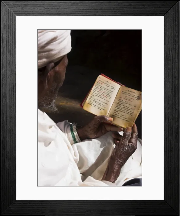 Framed Print : Old man wearing traditional gabi (white shawl) reading Holy Bible in rock-hewn monolithic church of Bet Medhane Alem (Saviour of the World), Lalibela Framed Print : Old man wearing traditional gabi (white shawl) reading Holy Bible in rock-hewn monolithic church of Bet Medhane Alem (Saviour of the World), Lalibela