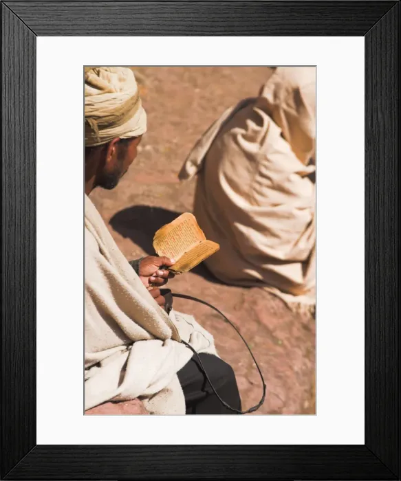 Framed Print : Pilgrim reads Holy Bible in Bet Maryam (St. Mary s) courtyard, Lalibela Framed Print : Pilgrim reads Holy Bible in Bet Maryam (St. Mary s) courtyard, Lalibela