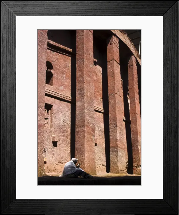 Framed Print : Old man wearing traditional gabi (white shawl) sitting in the sun reading holy bible Framed Print : Old man wearing traditional gabi (white shawl) sitting in the sun reading holy bible