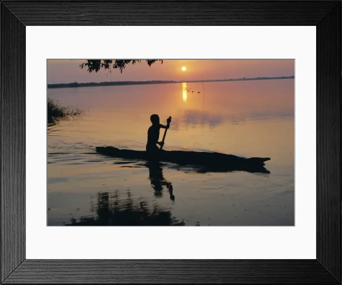 Framed Print : Anouak man in canoe, Lake Tata, Ethiopia, Africa Framed Print : Anouak man in canoe, Lake Tata, Ethiopia, Africa