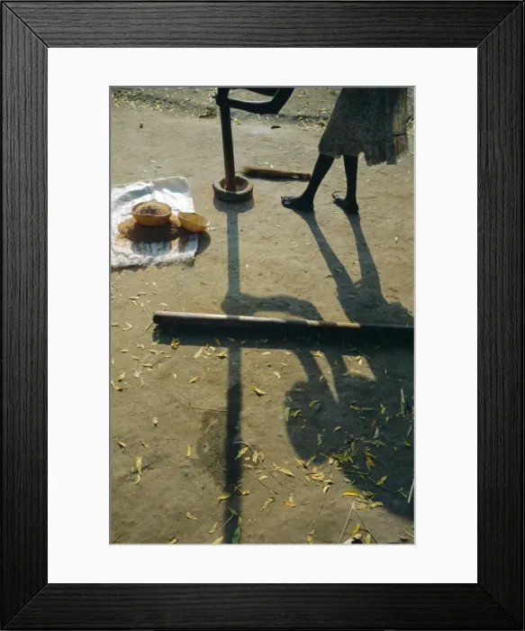 Framed Print : Anouak woman grinding corn using pestle and mortar, Deepa village, Lake Tata Framed Print : Anouak woman grinding corn using pestle and mortar, Deepa village, Lake Tata