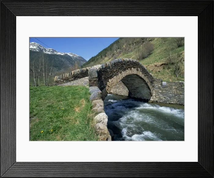 Framed Print : Ancient stone bridge over a river in the La Malana district in the Pyrenees in Andorra Framed Print : Ancient stone bridge over a river in the La Malana district in the Pyrenees in Andorra
