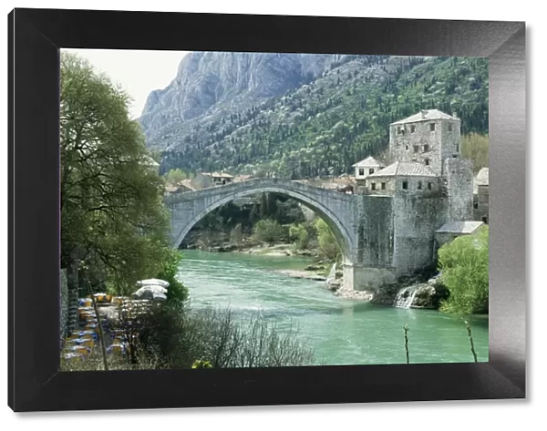 The Turkish Bridge over the River Neretva dividing the town, Mostar, Bosnia