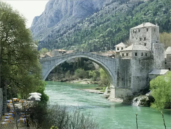 The Turkish Bridge over the River Neretva dividing the town, Mostar, Bosnia