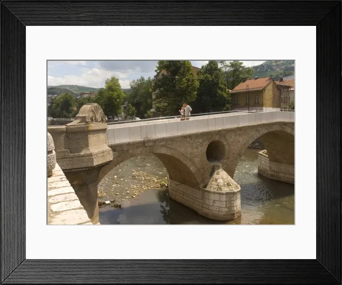 Framed Print : Couple on the Latin Bridge (Latinska cuprija), across the River Miljacka Framed Print : Couple on the Latin Bridge (Latinska cuprija), across the River Miljacka