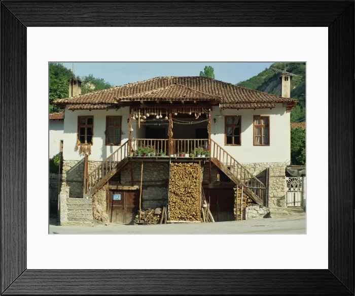 Framed Print : A traditional house with a log store, and gourds and chillies drying in the sun Framed Print : A traditional house with a log store, and gourds and chillies drying in the sun