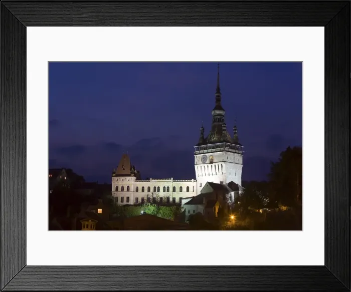 Framed Print : Clock tower (Turnul cu Ceas), illuminated at dusk, formerly the main entrance to the fortified city Framed Print : Clock tower (Turnul cu Ceas), illuminated at dusk, formerly the main entrance to the fortified city