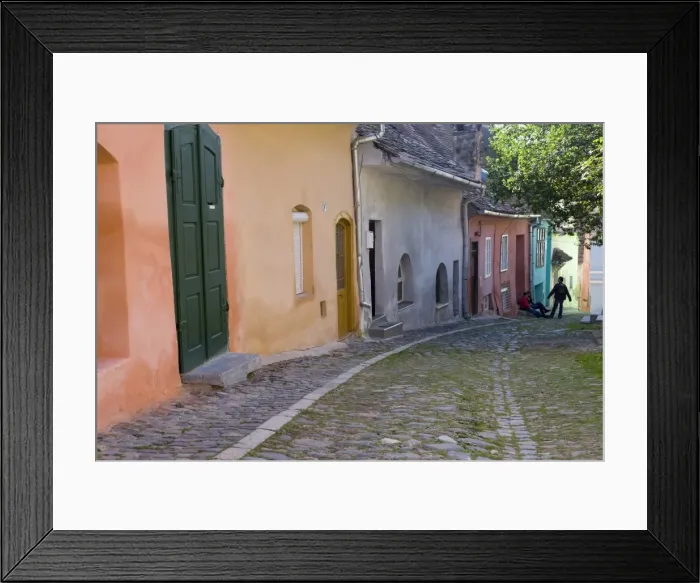 Framed Print : Cobbled streets lined with colourfully painted 16th century burgher houses in the medieval citadel Framed Print : Cobbled streets lined with colourfully painted 16th century burgher houses in the medieval citadel