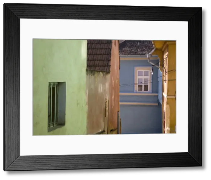 Framed Print : Colourfully painted 16th century burgher houses in the medieval citadel Framed Print : Colourfully painted 16th century burgher houses in the medieval citadel