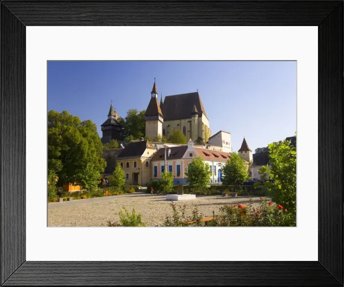 Framed Print : Medieval Roma village on the fortified church route, 15th century fortified church Framed Print : Medieval Roma village on the fortified church route, 15th century fortified church