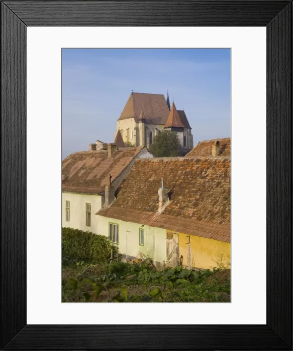 Framed Print : Medieval Roma village on the fortified church route, 15th century fortified church Framed Print : Medieval Roma village on the fortified church route, 15th century fortified church