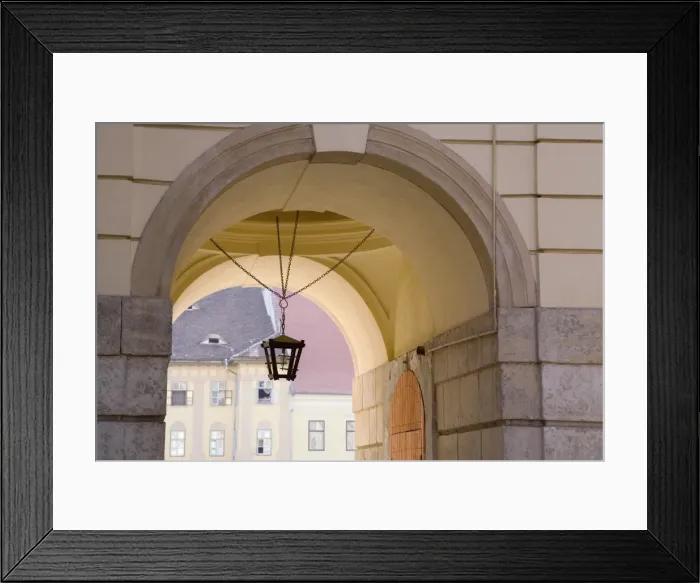 Framed Print : Decorative lantern hanging under an archway in the old towns main square Framed Print : Decorative lantern hanging under an archway in the old towns main square