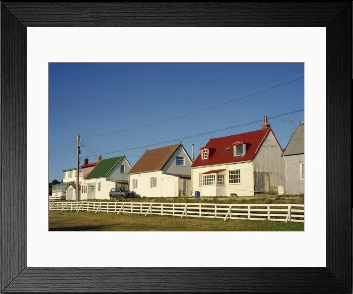 Framed Print : Houses of wood and corrugated iron line a typical street in Stanley, capital of the Falkland Islands Framed Print : Houses of wood and corrugated iron line a typical street in Stanley, capital of the Falkland Islands