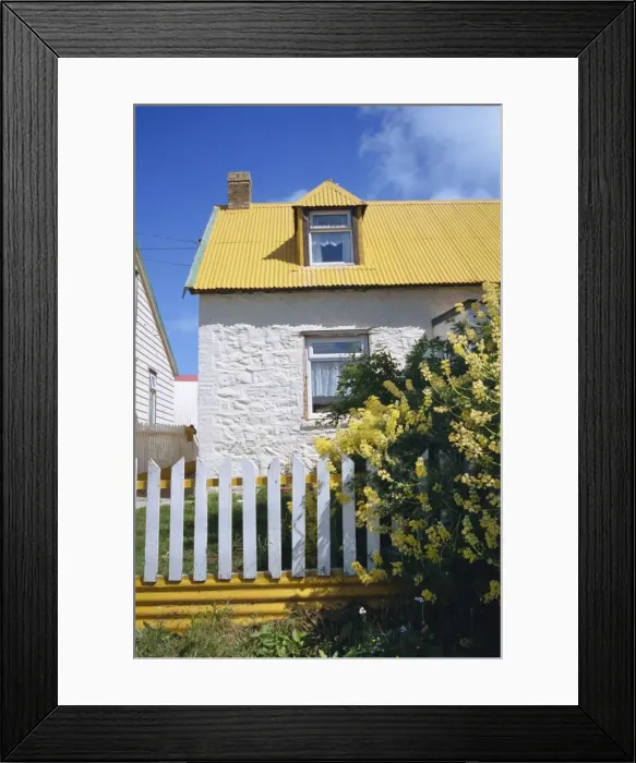 Framed Print : Typical house, with yellow corrugated roof and white stone walls and fence Framed Print : Typical house, with yellow corrugated roof and white stone walls and fence