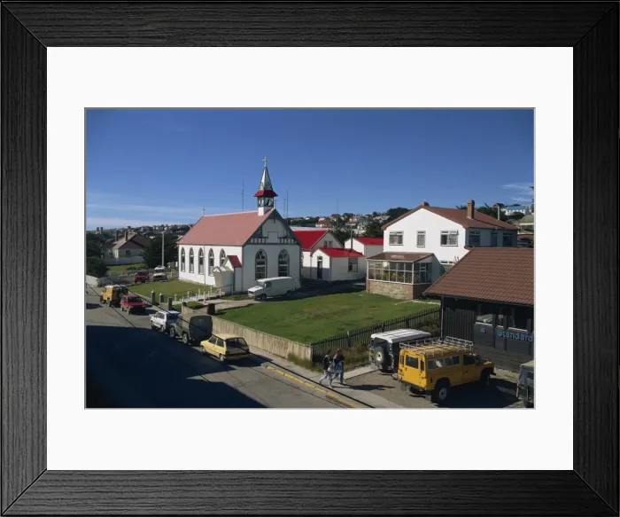Framed Print : The Roman Catholic cathedral and houses in the town of Stanley, capital of the Falkland Islands Framed Print : The Roman Catholic cathedral and houses in the town of Stanley, capital of the Falkland Islands