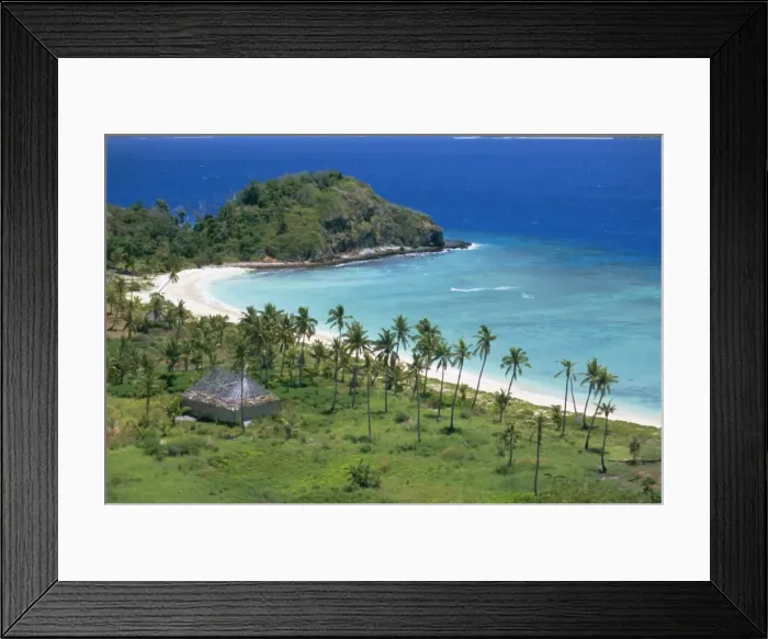 Framed Print : Coconut plantation and old farmhouse beside coral sand bay, Mana Island