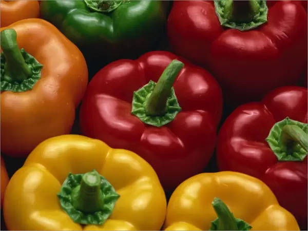 Close-up of yellow, red, orange and green peppers