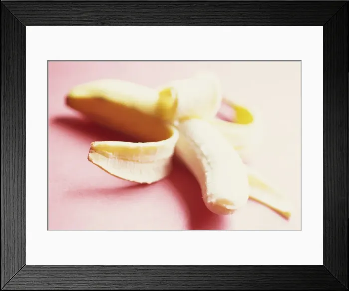 Framed Print : Close-up of a partly peeled banana Framed Print : Close-up of a partly peeled banana