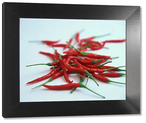 Red hot chillies on a white sheet