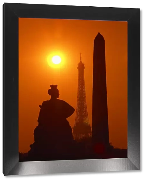 The Eiffel Tower, the Luxor Obelisk, 3200 years old, from Egypt, and the Strasbourg statue silhouetted at sunset, Place de la Concorde, Paris