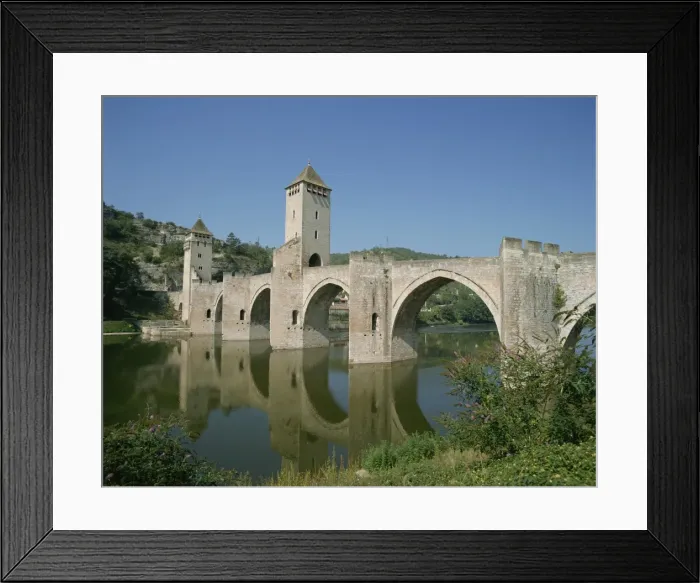 Framed Print : Reflections of the bridge and towers of the Pont Valentre across the River Lot at Cahors Framed Print : Reflections of the bridge and towers of the Pont Valentre across the River Lot at Cahors