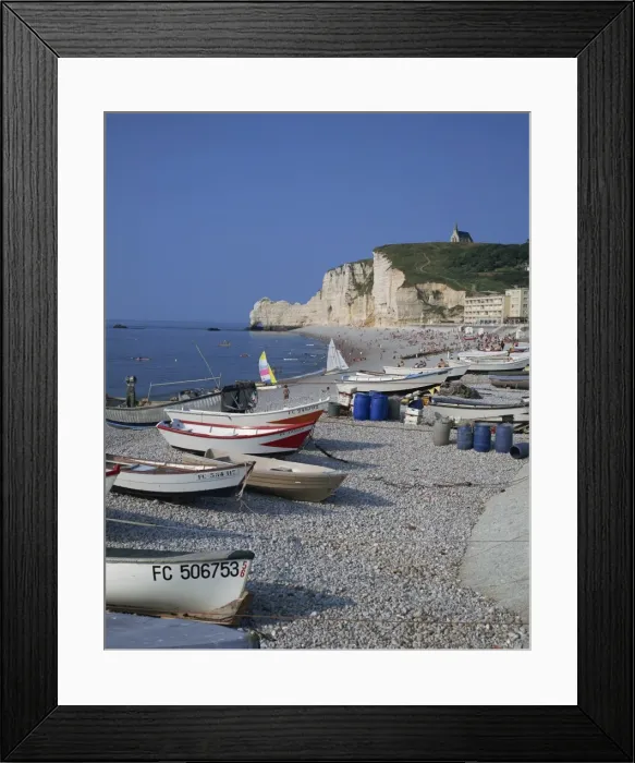 Framed Print : Small boats and people on the beach with cliffs in the background, at Etretat