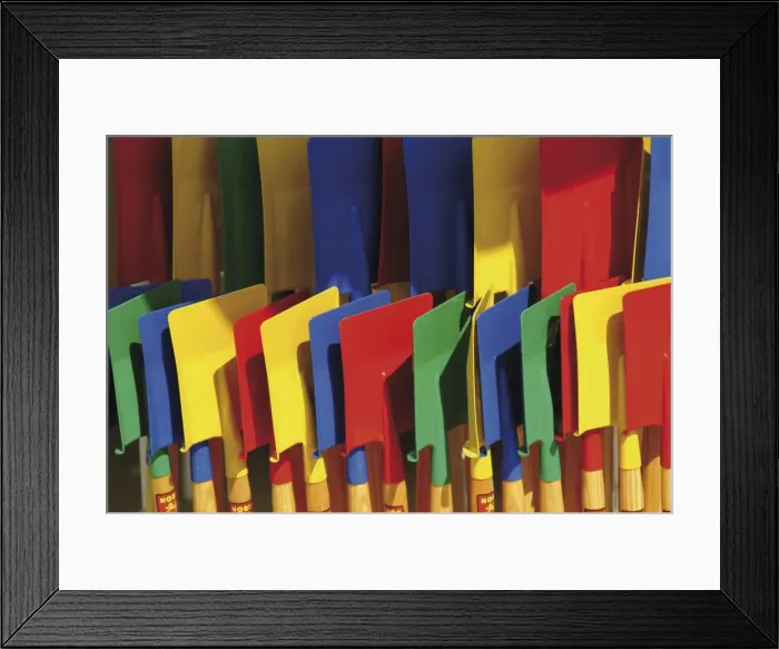Framed Print : Multi coloured spades on sale at a beach shop on the Planche, Deauville Framed Print : Multi coloured spades on sale at a beach shop on the Planche, Deauville