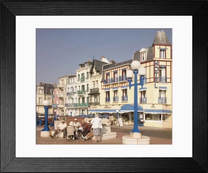 Framed Print : Group of elderly people sitting on seafront in the restort town of Mers les Bains Framed Print : Group of elderly people sitting on seafront in the restort town of Mers les Bains