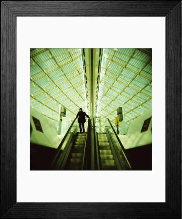 Framed Print : Man on escalator, Charles de Gaulle Airport, Paris, France, Europe Framed Print : Man on escalator, Charles de Gaulle Airport, Paris, France, Europe