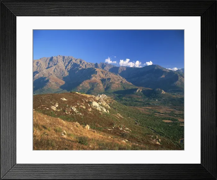 Framed Print : Aerial view over the village of Montemaggiore, clinging to hillside beneath the Monte Grosso Massif Framed Print : Aerial view over the village of Montemaggiore, clinging to hillside beneath the Monte Grosso Massif
